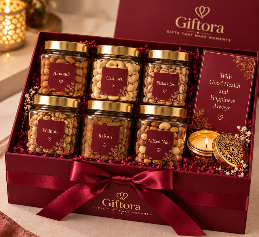 Maroon gift box with assorted nuts, candle and greeting card